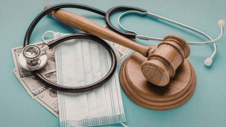 Gavel, stethoscope, and medical mask representing a lawsuit for doctor misdiagnosis